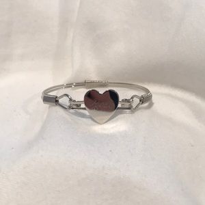 bracelet with a heart that reads Rose